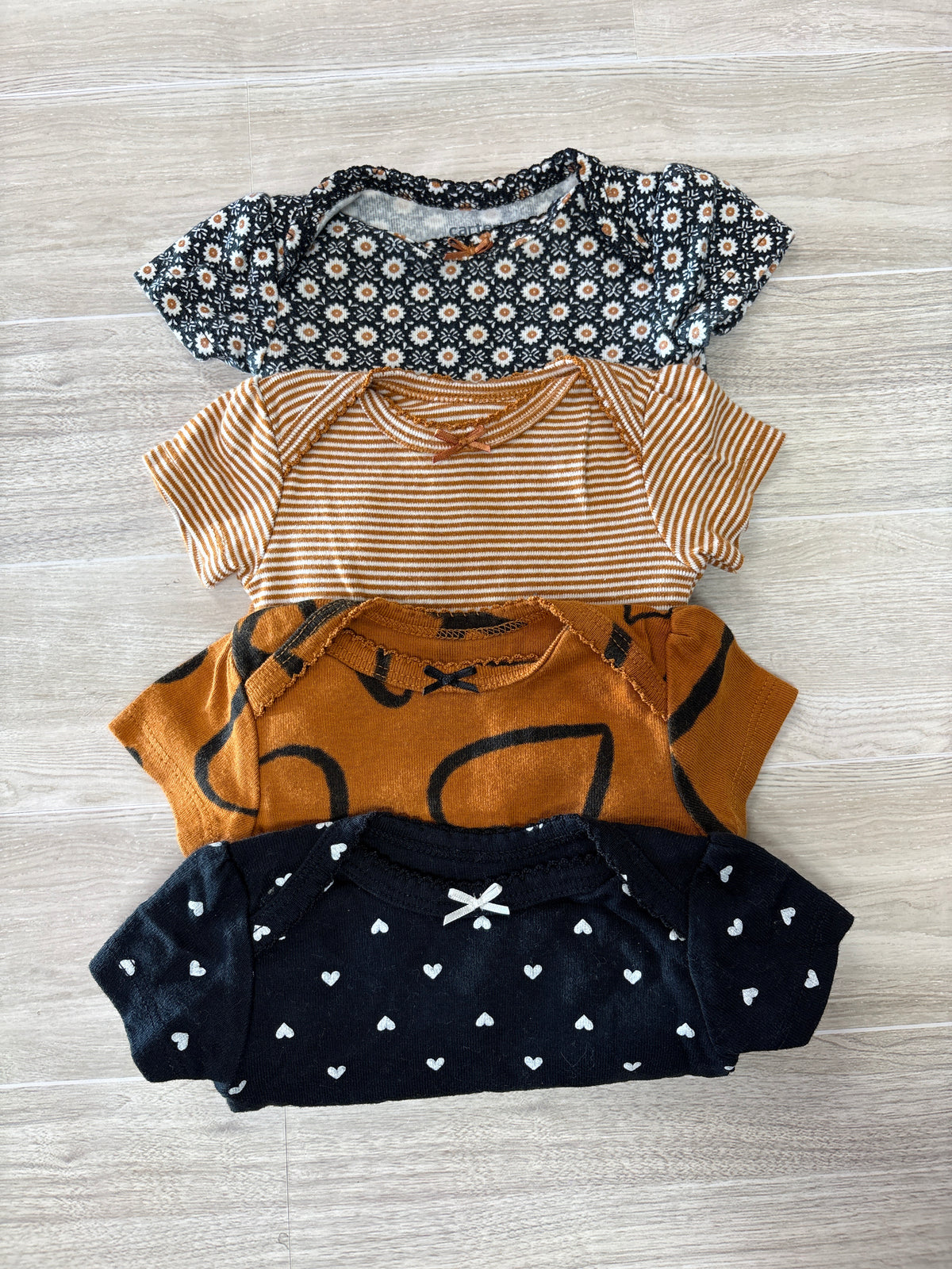 Newborn Onesie 4 Pack Black Heart/Rust Heart/Striped/Floral