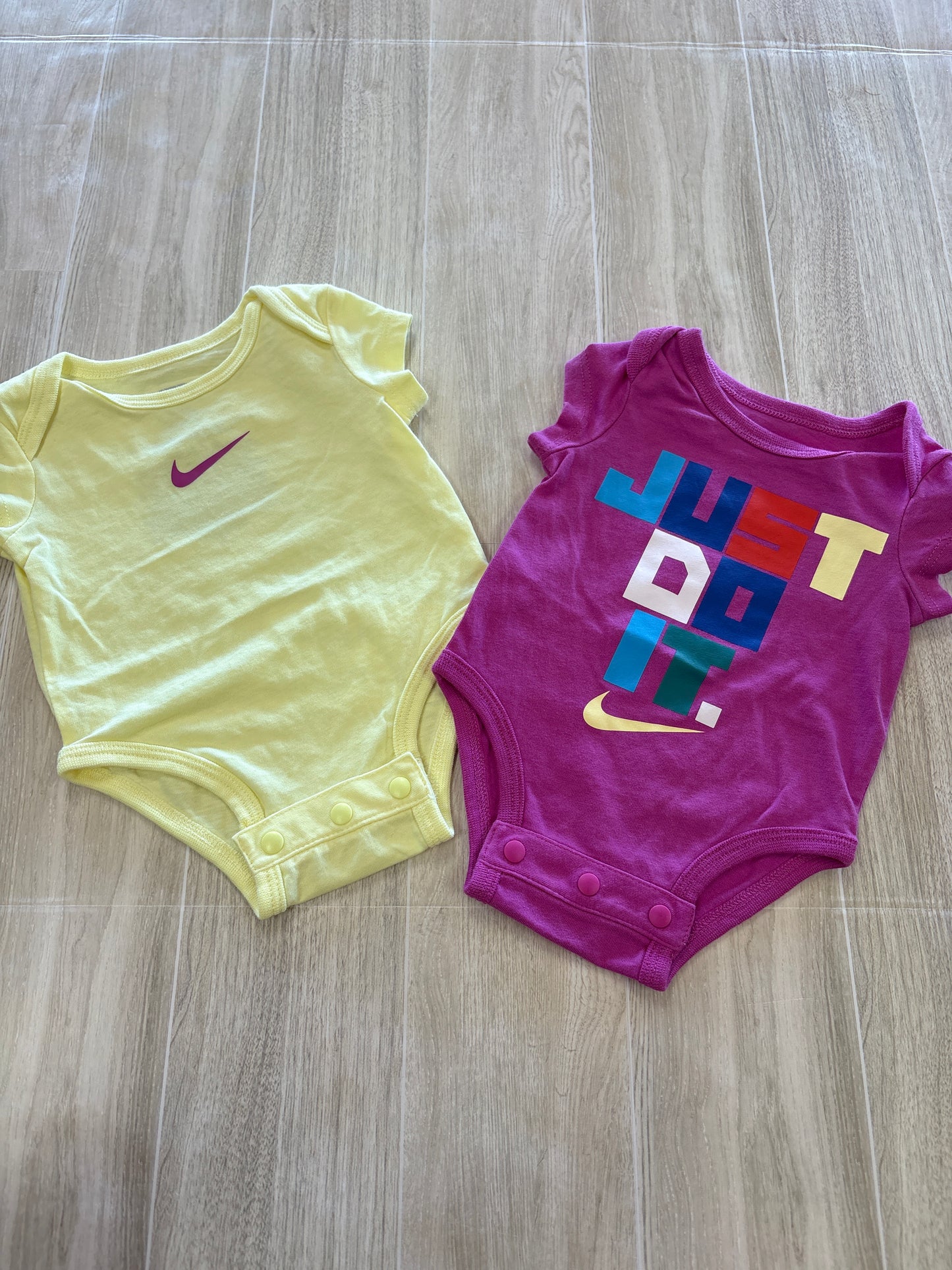 Newborn Nike Pink/Yellow Onesie 2 Pack